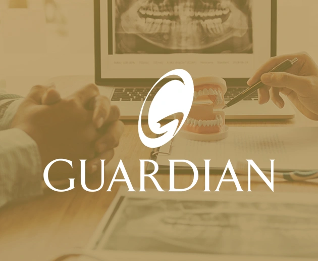 Guardian logo displayed over dental consultation scene with dentist and patient in office.