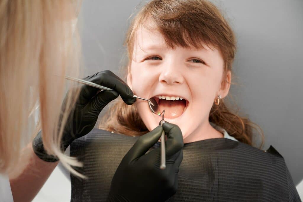 Child receiving a routine dental checkup from a family dentist in Gilbert, AZ