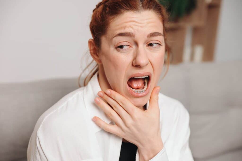 Patient with persistent jaw pain who may benefit from TMJ treatment in Gilbert.